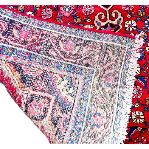 278 - A Hamadan rug, caucasian medallion on red ground with floral design, and dark blue ground borders, 2... 