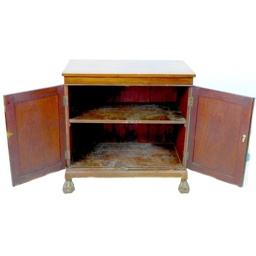 280 - An early 20th century mahogany two door cupboard, the twin panel door enclosing two shelves, raised ... 