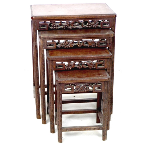 284 - A nest of four Chinese hardwood tables, early 20th century, the rectangular surfaces with canted edg... 