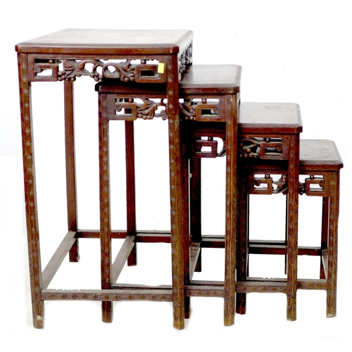 284 - A nest of four Chinese hardwood tables, early 20th century, the rectangular surfaces with canted edg... 