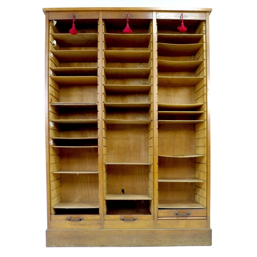 285 - An early to mid 20th century oak tambour fronted filing unit, with three vertical sections, each wit... 