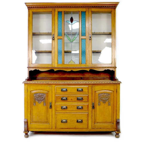 287 - An early 20th century French oak dresser, the upper section with stained-glass central panel, flanke... 