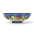 A Moorcroft pottery Tiger Lily pattern bowl, with impressed marks to base, 25.5 by 8.5cm high, with ... 