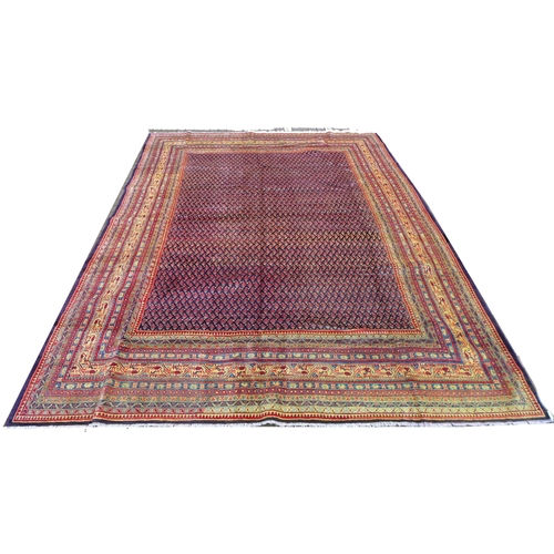 290 - An Araak rug, profuse geometric decoration upon a red ground with multi-coloured ground borders, 365... 