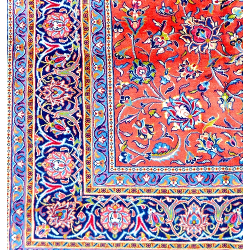 295 - A Sarough rug, with floral design across central red ground and dark blue ground borders, 350 by 250... 