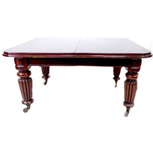 298 - A Victorian mahogany extending dining table, with three additional leaves, raised on turned and reed... 