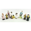 A group of eight Royal Doulton figures, comprising 'Storytime', HN3695, 10.5cm high, 'First Prize', ... 
