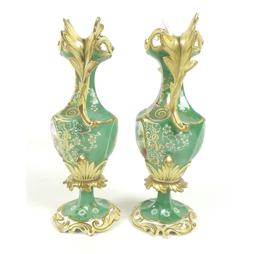 64 - A pair of mid 19th century porcelain twin handled vases, possibly Minton, decorated with reserves de... 