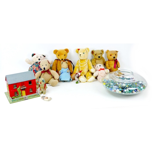 73 - A group of retro and vintage toys, including a collection of marbles, soft toys, and vintage scratch... 