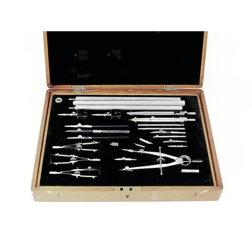 79 - A 1960s cased Riefler draughtsman set, with some pieces made by other manufacturers, with fitted woo... 