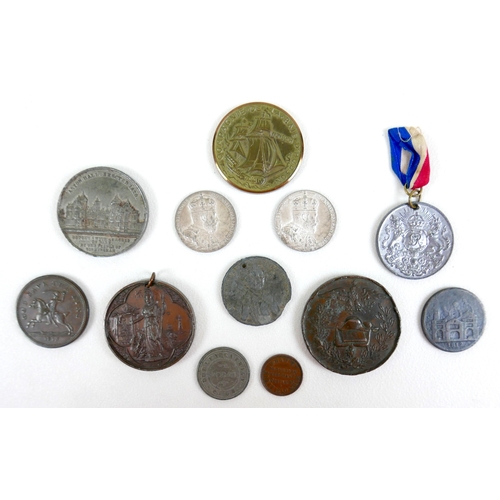 81 - A group of commemorative medallions and tokens, 18th to 20th century, including George V and Edward ... 