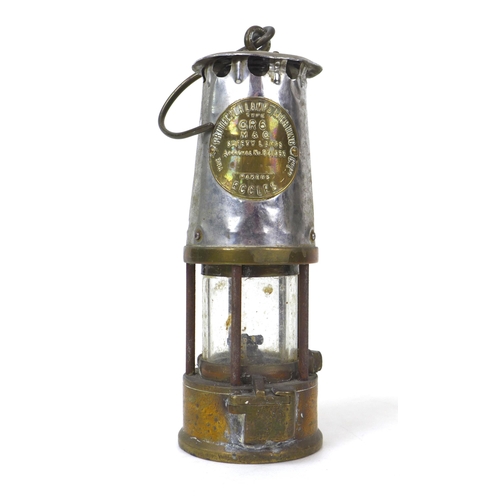 82 - An early 20th century Protector Lamp & Lighting Co. Ltd. safety lamp, GR6, with brass and white meta... 