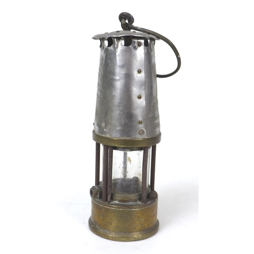 82 - An early 20th century Protector Lamp & Lighting Co. Ltd. safety lamp, GR6, with brass and white meta... 