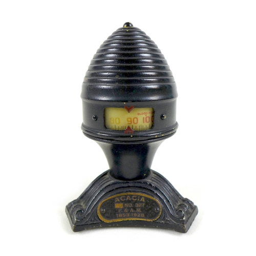 84 - Masonic interest: a Thermo-Dial desktop thermometer, circa 1928, of beehive form on triangular base,... 