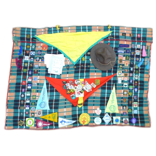 88 - A late 20th century Boy Scout blanket and associated ephemera, the blanket with badges from the UK a... 