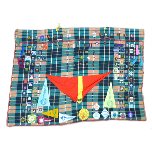 88 - A late 20th century Boy Scout blanket and associated ephemera, the blanket with badges from the UK a... 