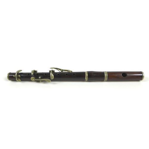 92 - An early 20th century rosewood and silver plated piccolo, 28cm long.