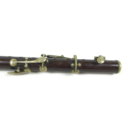 92 - An early 20th century rosewood and silver plated piccolo, 28cm long.