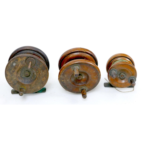 94 - Three mid 20th century wooden fishing reels, all without makers' names, together with two vintage ba... 