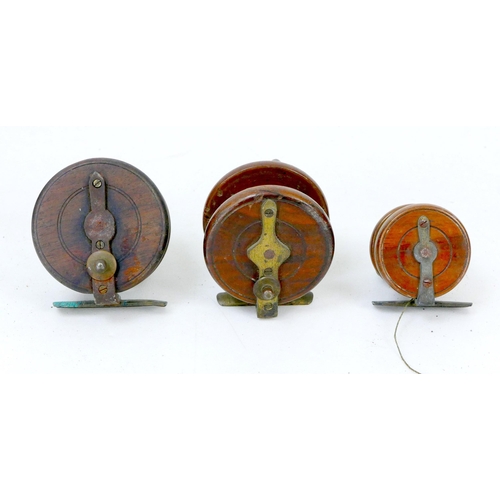 94 - Three mid 20th century wooden fishing reels, all without makers' names, together with two vintage ba... 