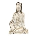 A Chinese blanc de chine porcelain sculpture, probably 18th century, modelled as Guanyin, in seated ... 