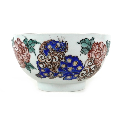 44 - A Chinese porcelain bowl, late 19th / early 20th century, decorated with blue foo dogs amongst red f... 