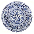A Chinese Ming style blue and white porcelain dish, late 20th century, with scalloped rim, decorated... 