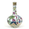 A Canton porcelain bottle vase, late 19th century, typically decorated with reserves of figures agai... 