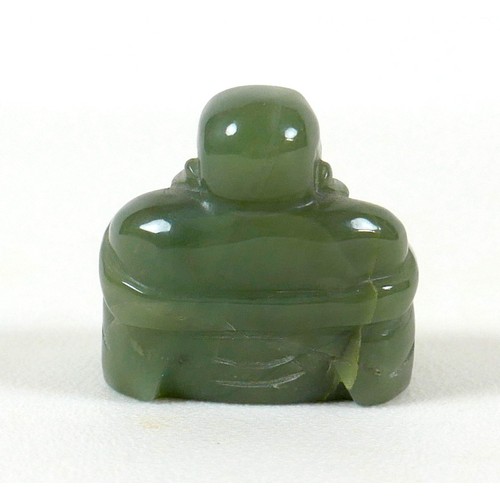 6 - A Chinese carved jade Buddha, 4.5cm high.