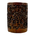 A Chinese bamboo brush pot (bitong), 19th century, of cylindrical form, carved in relief with a land... 