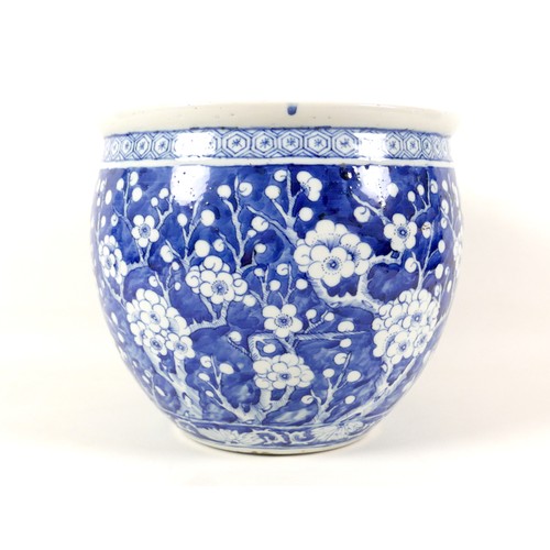 2 - A Chinese porcelain fish bowl, decorated in underglaze blue with prunus blossom against a cracked ic... 
