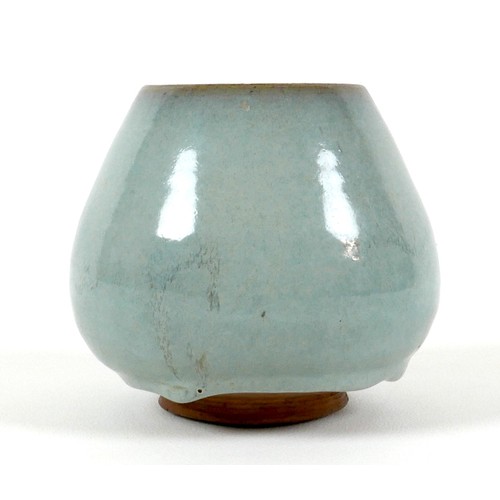 36 - A Chinese pottery vase, decorated in an allover green glaze with asymmetric glaze line to lower rim,... 