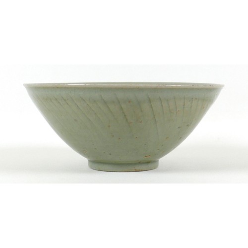 13 - A Chinese porcelain bowl, late 20th century, incised decoration beneath a green glaze, 18.5 by 8cm h... 
