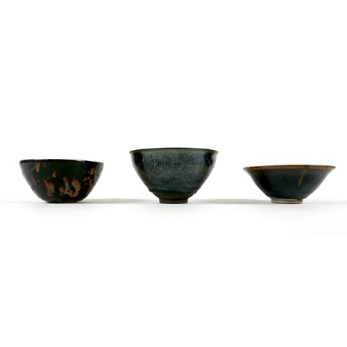 14 - A group of three Chinese pottery bowls,  late 20th century, with black and brown glazes, the largest... 