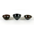 A group of three Chinese pottery bowls,  late 20th century, with black and brown glazes, the largest... 