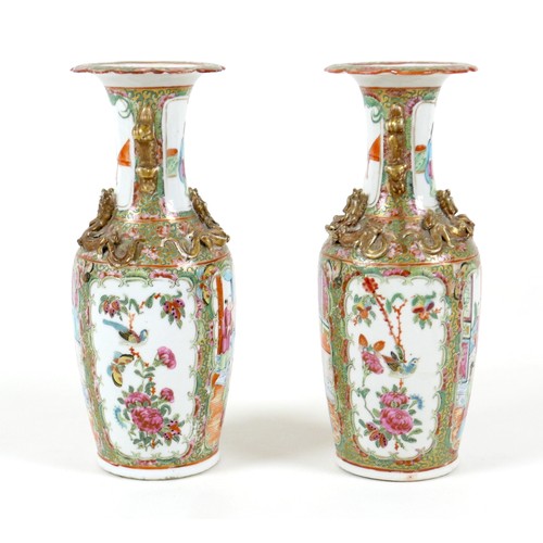 52 - A pair of Canton porcelain vases, mid to late 19th century, typically decorated, each 10 by 25cm hig... 