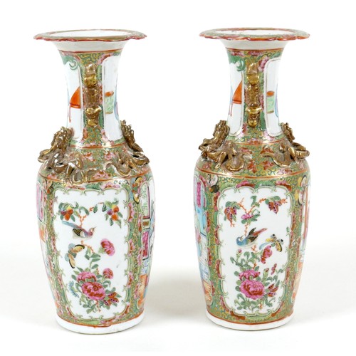 52 - A pair of Canton porcelain vases, mid to late 19th century, typically decorated, each 10 by 25cm hig... 