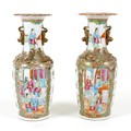 A pair of Canton porcelain vases, mid to late 19th century, typically decorated, each 10 by 25cm hig... 