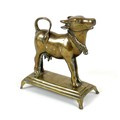 A 19th century Indian brass ornament, modelled as a cow in standing pose with head raised, with engr... 