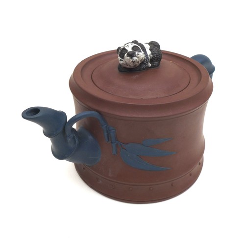 12 - A Chinese Yixing pottery teapot, with panda form finial, contracting colour bamboo effect handle and... 