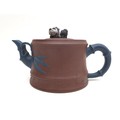 A Chinese Yixing pottery teapot, with panda form finial, contracting colour bamboo effect handle and... 
