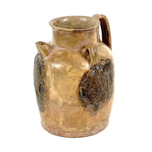 33 - A Chinese Tang Dynasty pottery wine jar, with short spout and three loop handles, applied decoration... 