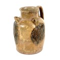 A Chinese Tang Dynasty pottery wine jar, with short spout and three loop handles, applied decoration... 