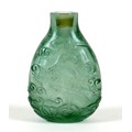 A Chinese carved glass scent bottle, depicting an eagle amongst scrolling clouds, incised mark to ba... 