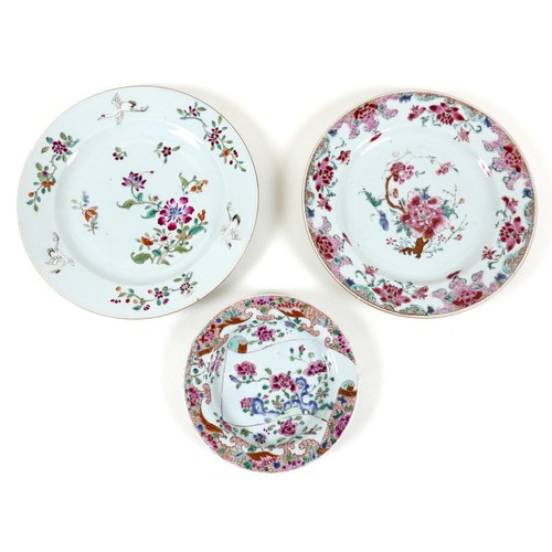 56 - A group of three Chinese famille rose porcelain plates, Qing Dynasty, 18th century, one decorated in... 