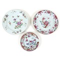 A group of three Chinese famille rose porcelain plates, Qing Dynasty, 18th century, one decorated in... 