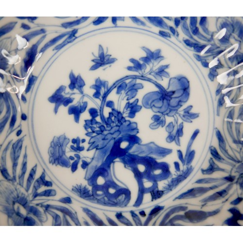 29 - A group of 18th and 19th century Chinese porcelain saucer dishes, one decorated in Willow pattern wi... 