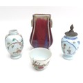 A collection of four Chinese porcelain vases, including a sang de boeuf glaze arrow form vase, with ... 