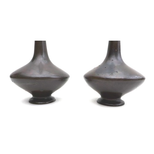 18 - A pair of Japanese bronze vases, early 20th century, with slender necks, a/f damage, 26.5cm high. (2... 