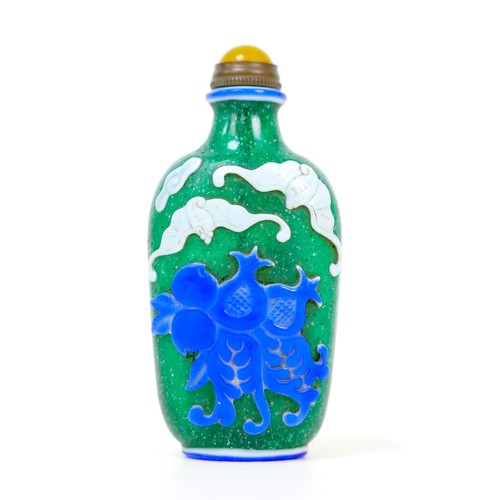 17 - A Chinese glass scent bottle, flashed blue and white, decorated with bats and pomegranates, green an... 